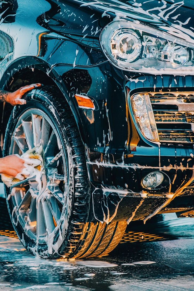 Detailing An expert details tire rims with extreme care