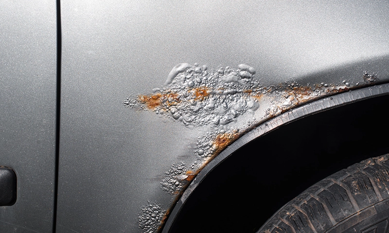 Rust Rust forming under paint above a tire well